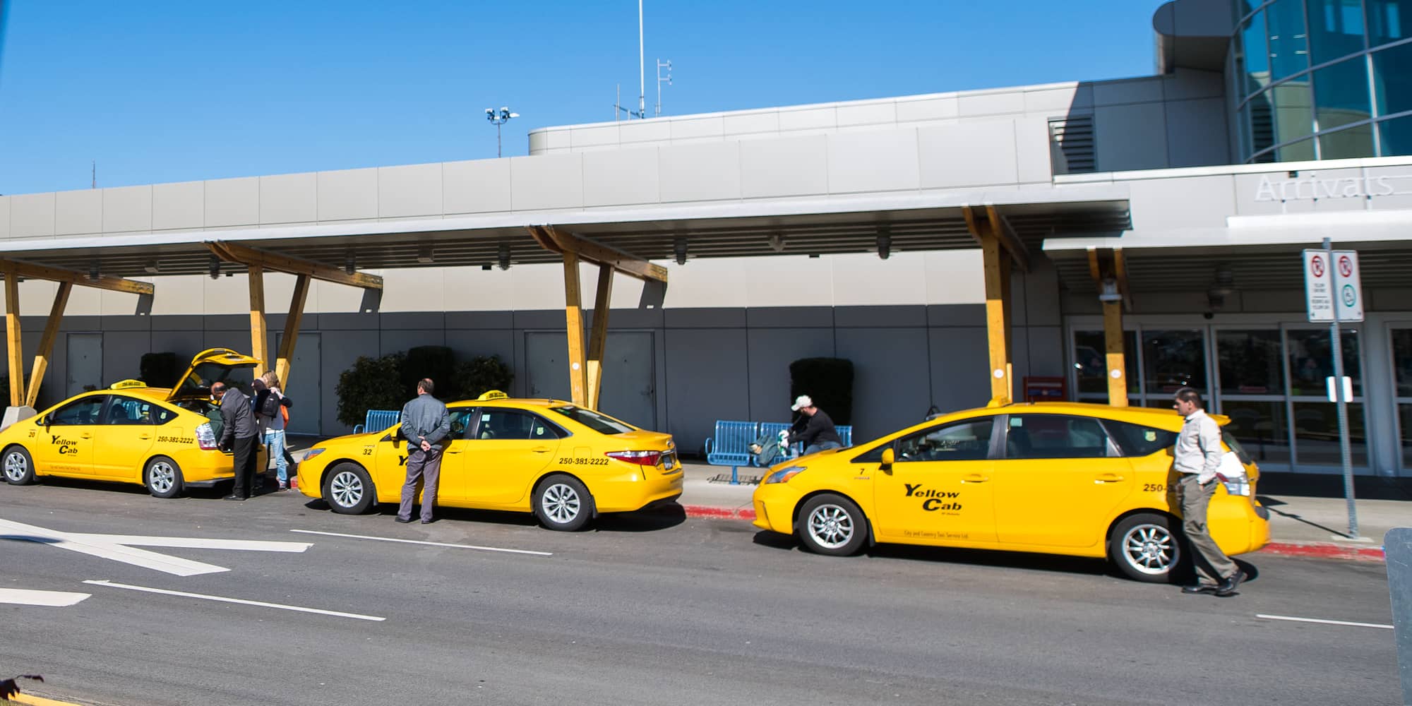Cab drivers wait for fares outside the Victoria International Airport on March 18, the first day of mandatory closure for BC's bars and pubs (James MacDonald for The Capital)