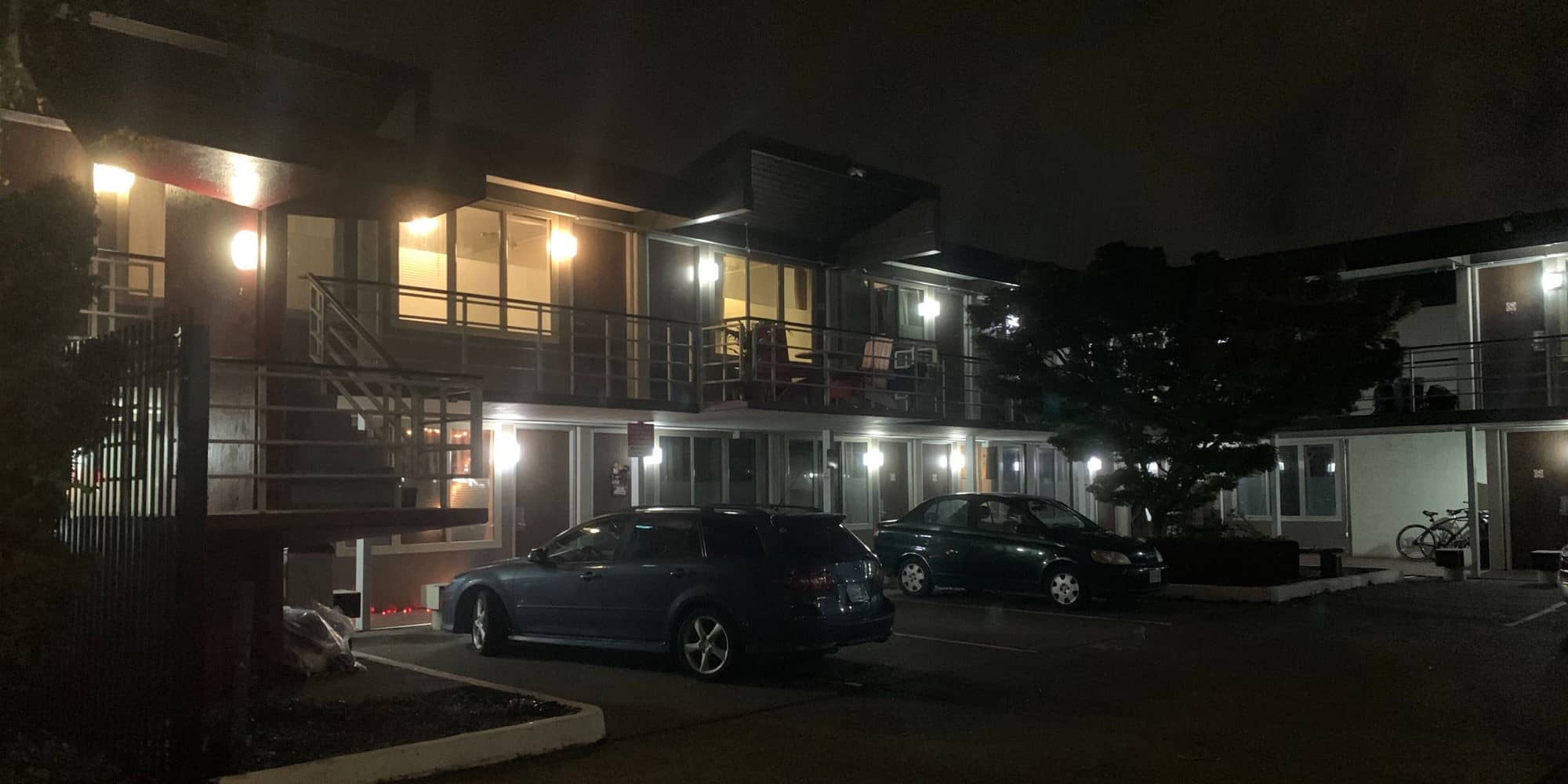 A nighttime view of the former Paul's Motor Inn, which was purchased by BC Housing in June to serve as a homeless shelter.