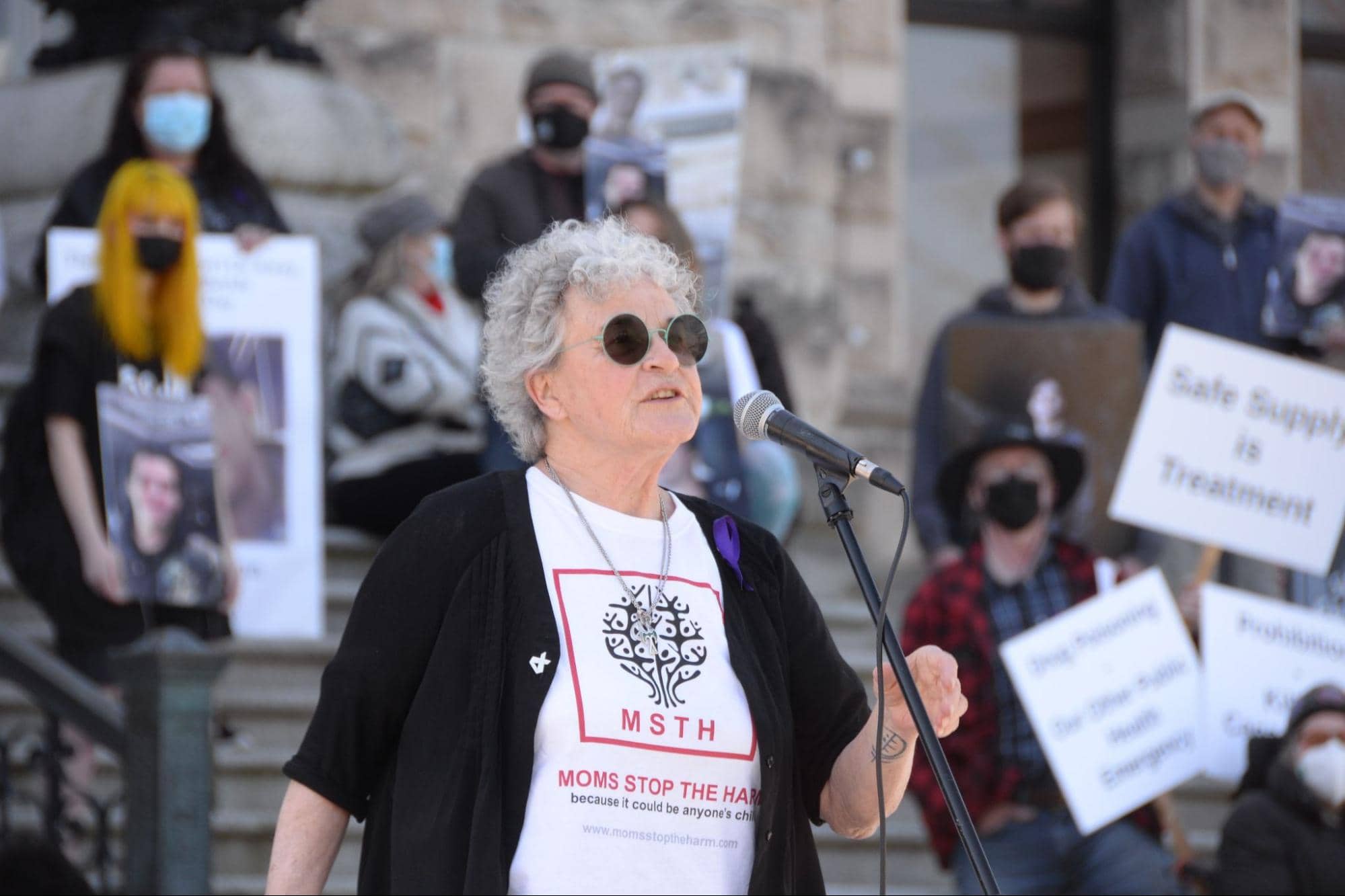 Leslie McBain, co-founder of Moms Stop the Harm, speaks at a rally on the steps of the BC Parliament building on April 14, five years and 7,000 deaths after the overdose crisis was deemed a public health emergency by the B.C. government. Photo: Nina Grossman / Capital Daily