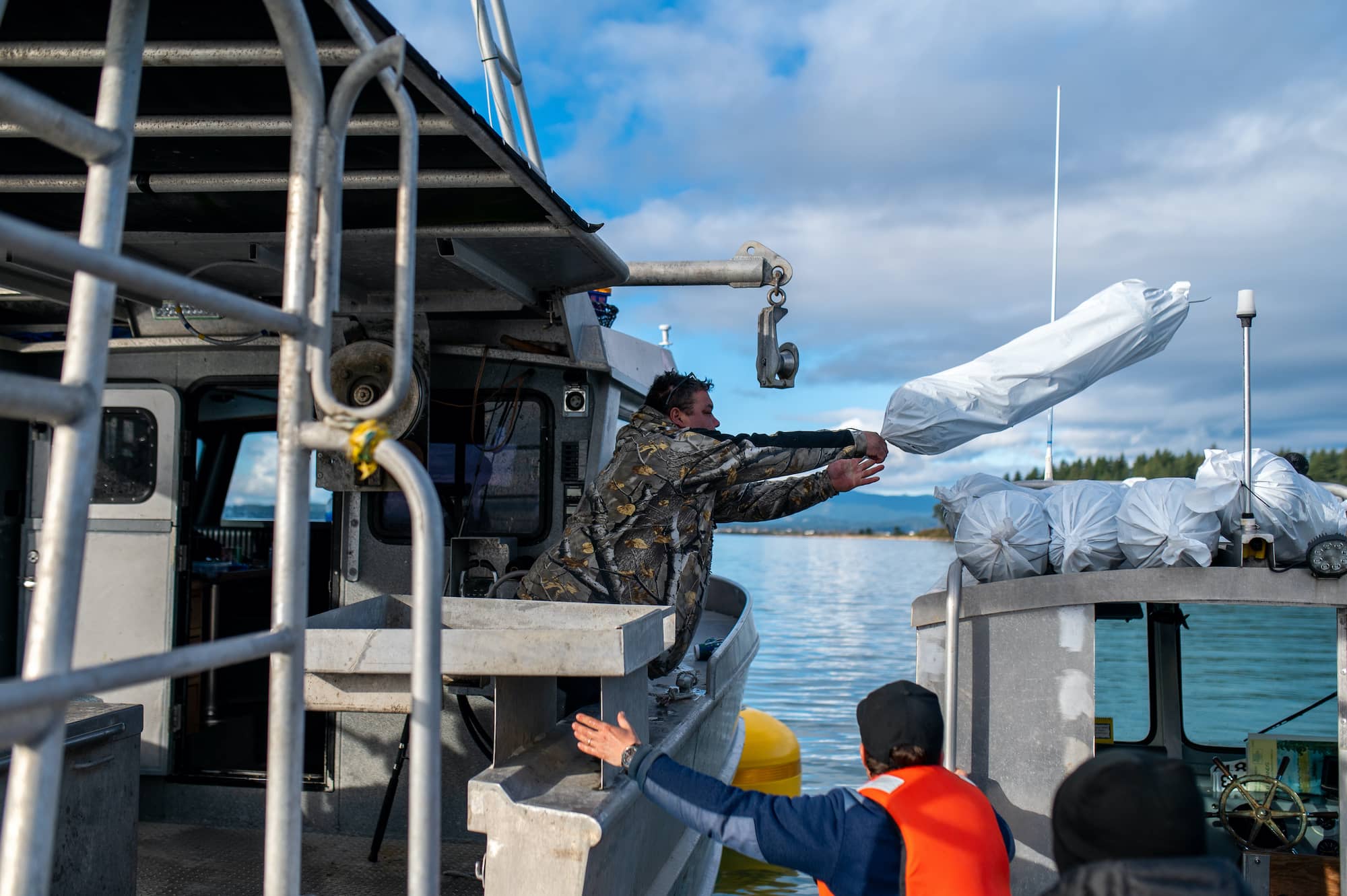 Workers prepare the seaweed farm off Sidney. Photo: James MacDonald / Capital Daily