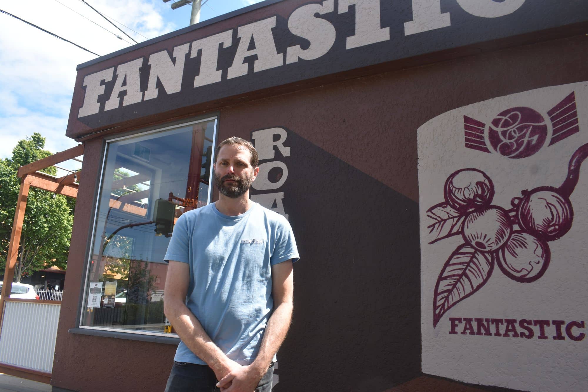 Caffe Fantastico owner Ryan Taylor stands outside of his Quadra Village cafe on June 16. Photo: Martin Bauman / Capital Daily
