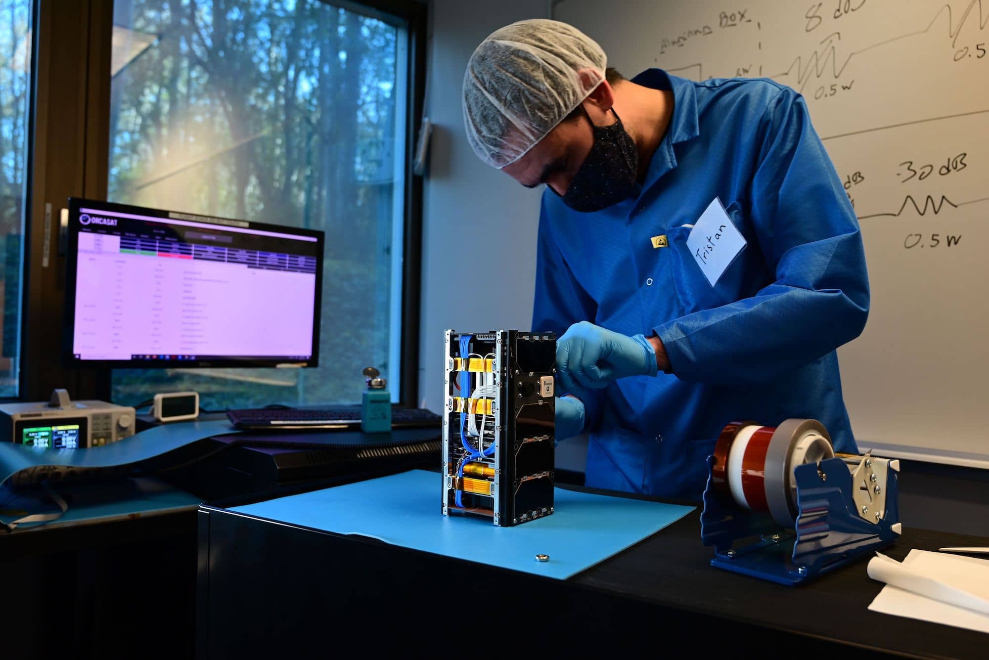 Tristan Tarnowski, ORCASat team member and UVic engineering student, during assembly of the UVic satellite. Photo: Provided by ORCASAT.
