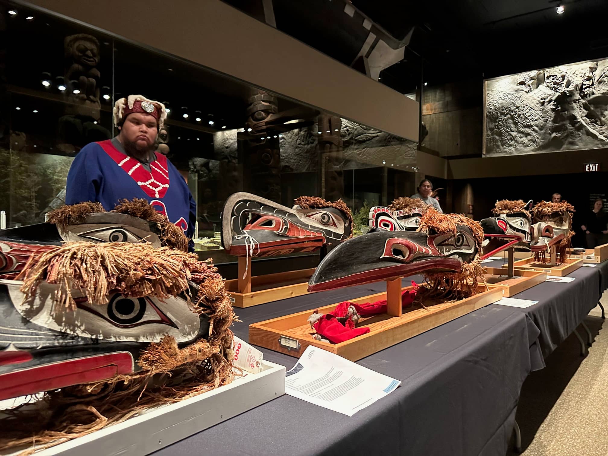 Chief Pangwidi (Walter George) surveys masks from his family. Photo: Courtesy of Murray Browne
