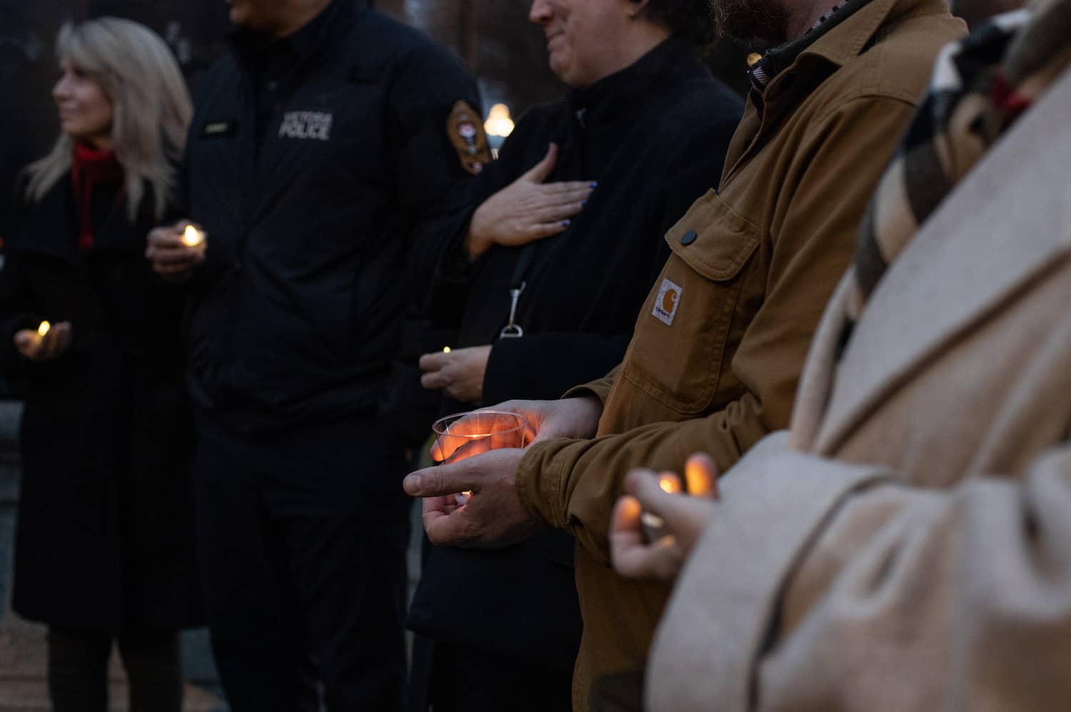 Community members gather to mourn those they've lost. Photo by Robyn Bell