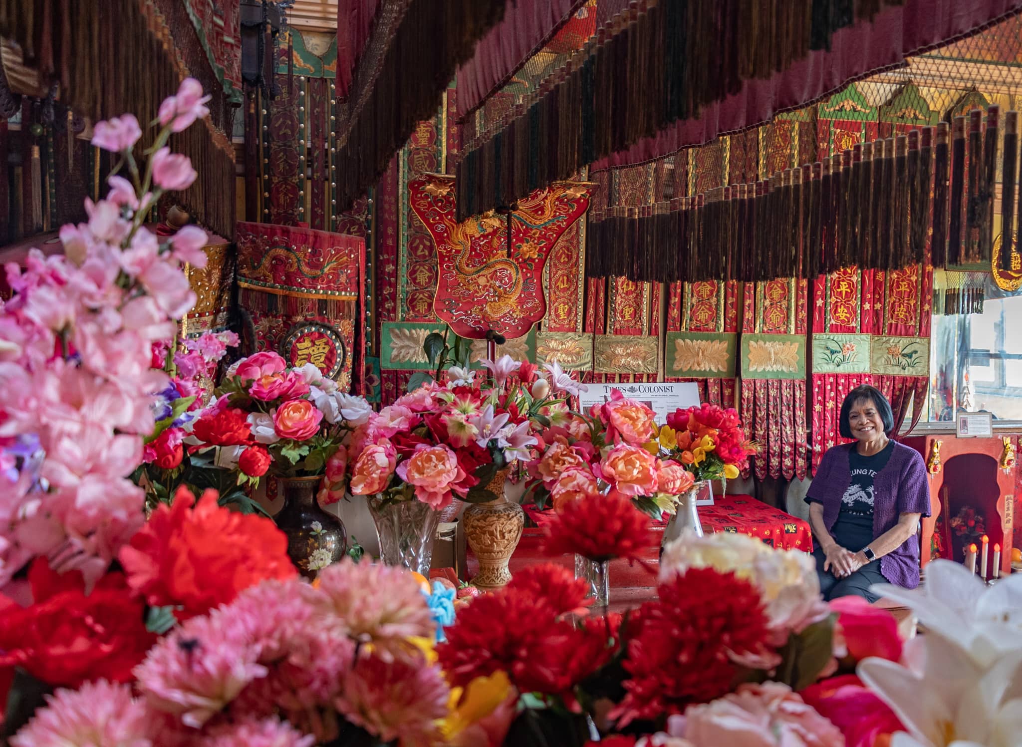 Nora Butz, Yen Wo Society president, sits in the Tam Kung Temple. Photo: Robyn Bell / Capital Daily