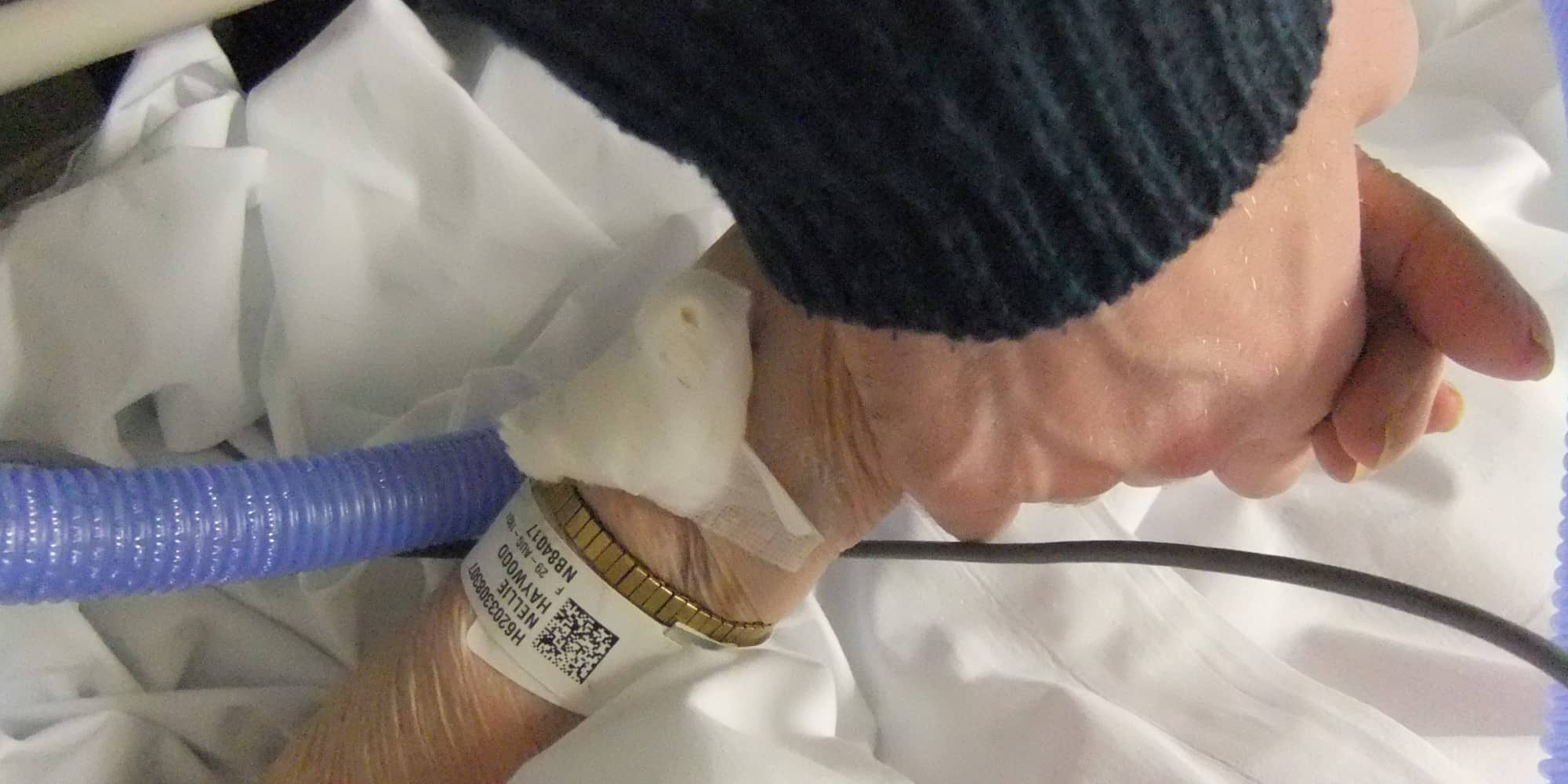 English photographer Lee Haywood holds the hand of his dying grandmother in this 2010 photo (Flickr.com/LeeHaywood)