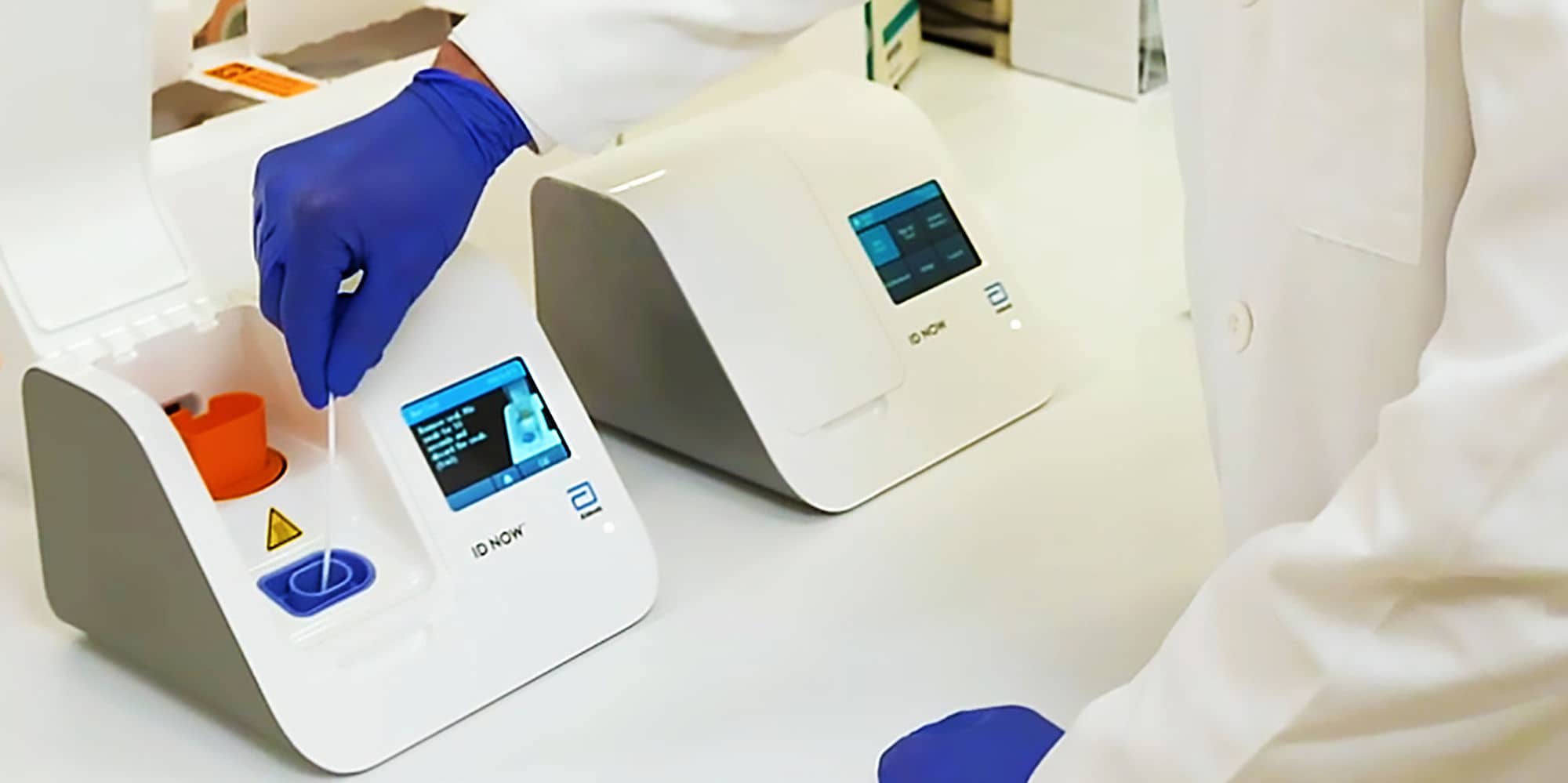 This handout photo by Abbott shows a toaster-sized testing station that could see COVID-19 tests performed in minutes without the need for professional lab technicians.