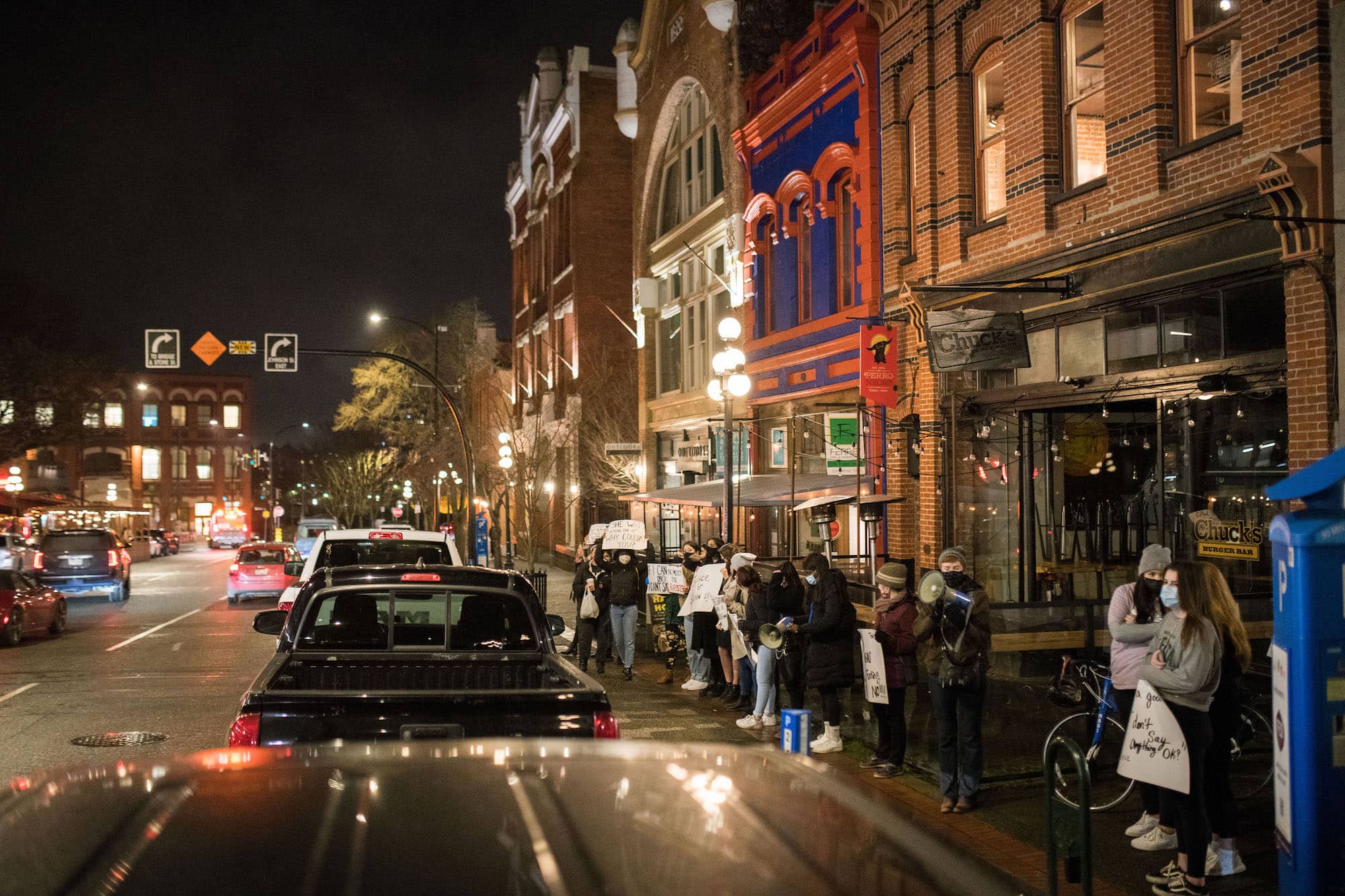 Protestors rally outside Chuck's Burger Bar in Victoria on Feb. 4. Photo: James MacDonald / Capital Daily