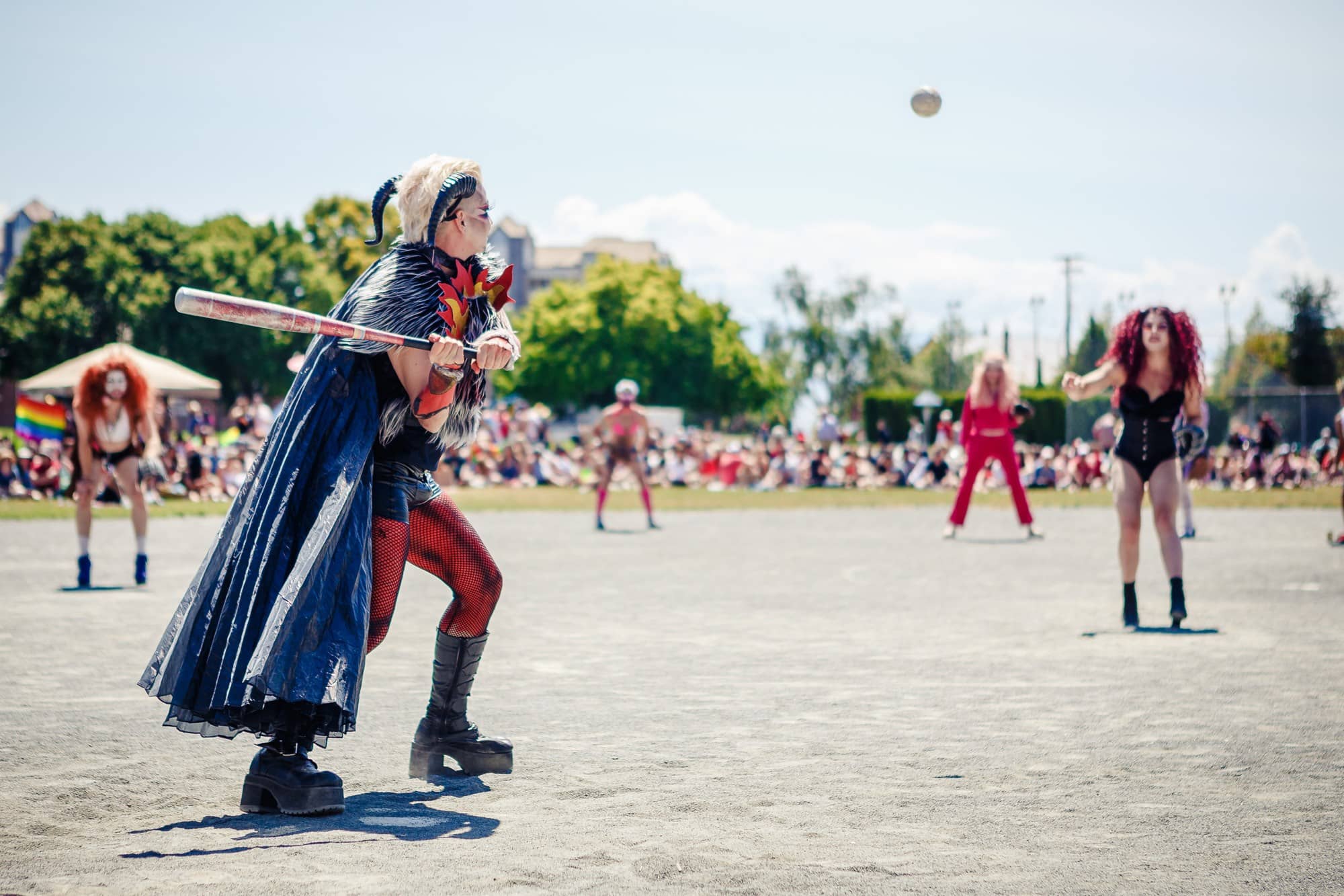 Drag king Persi Flage winds up to hit a pitch at the 2019 Memorial Drag Ball game. Photo: Peter B. Jakab Photography / Victoria Pride Society