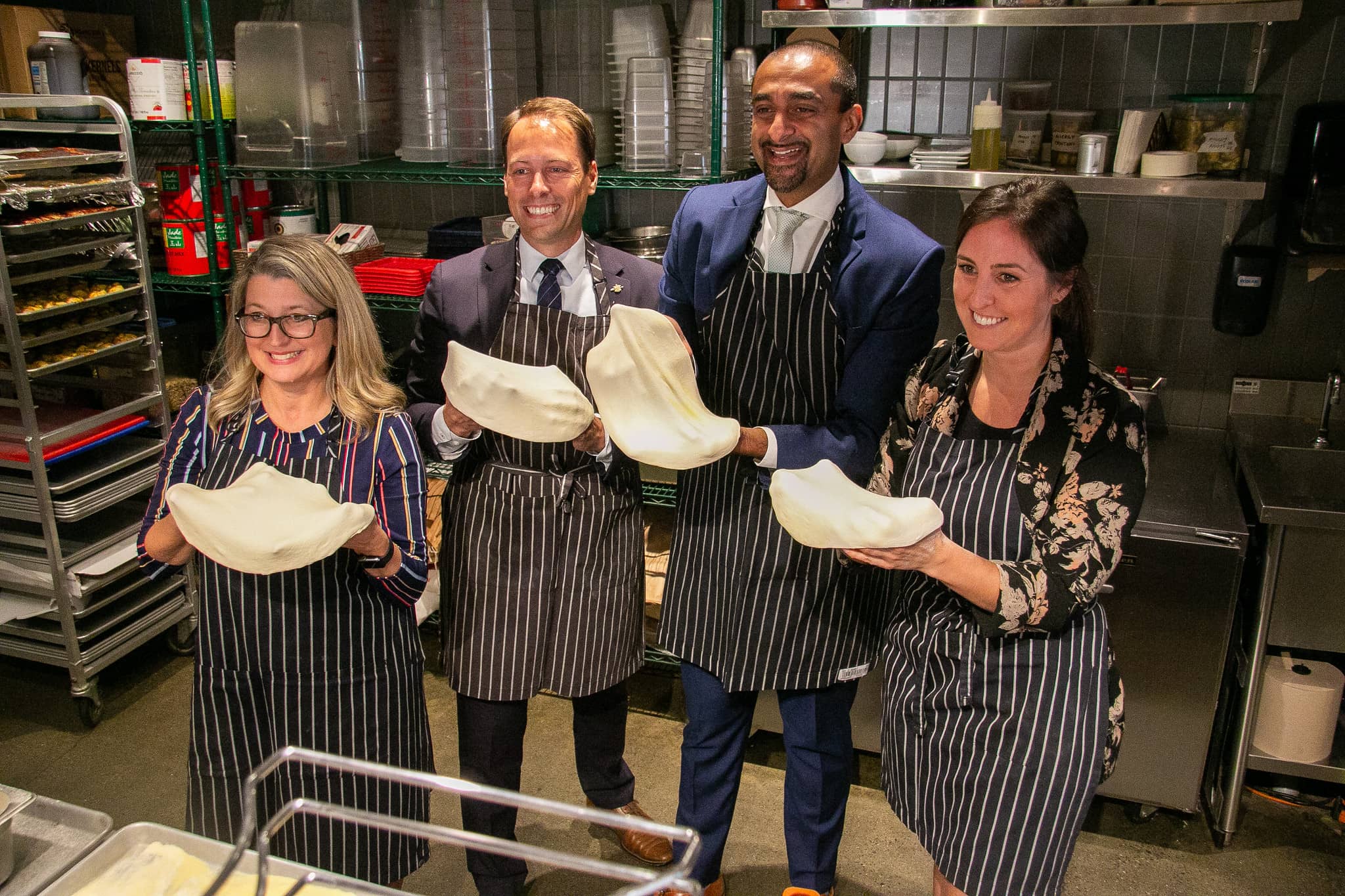 Ravi Kahlon, Minister of Jobs, Economic Recovery, and Innovation (second from right) announced the cap at Virtuous Pie on Thursday. Photo: Government of BC via Flickr