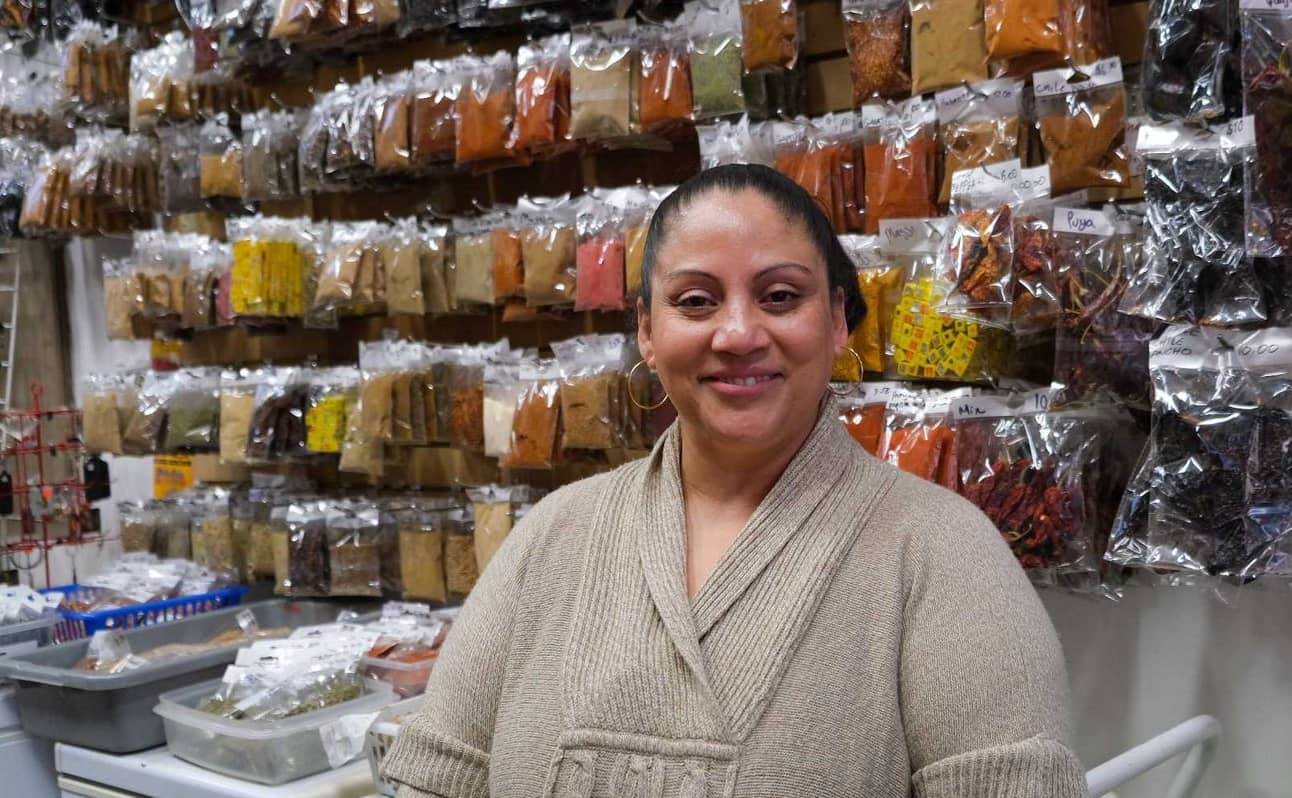 Maritza Sanchez, behind the eponymous wall of spice inside the Mexican House of Spice/Photo: Michael John Lo
