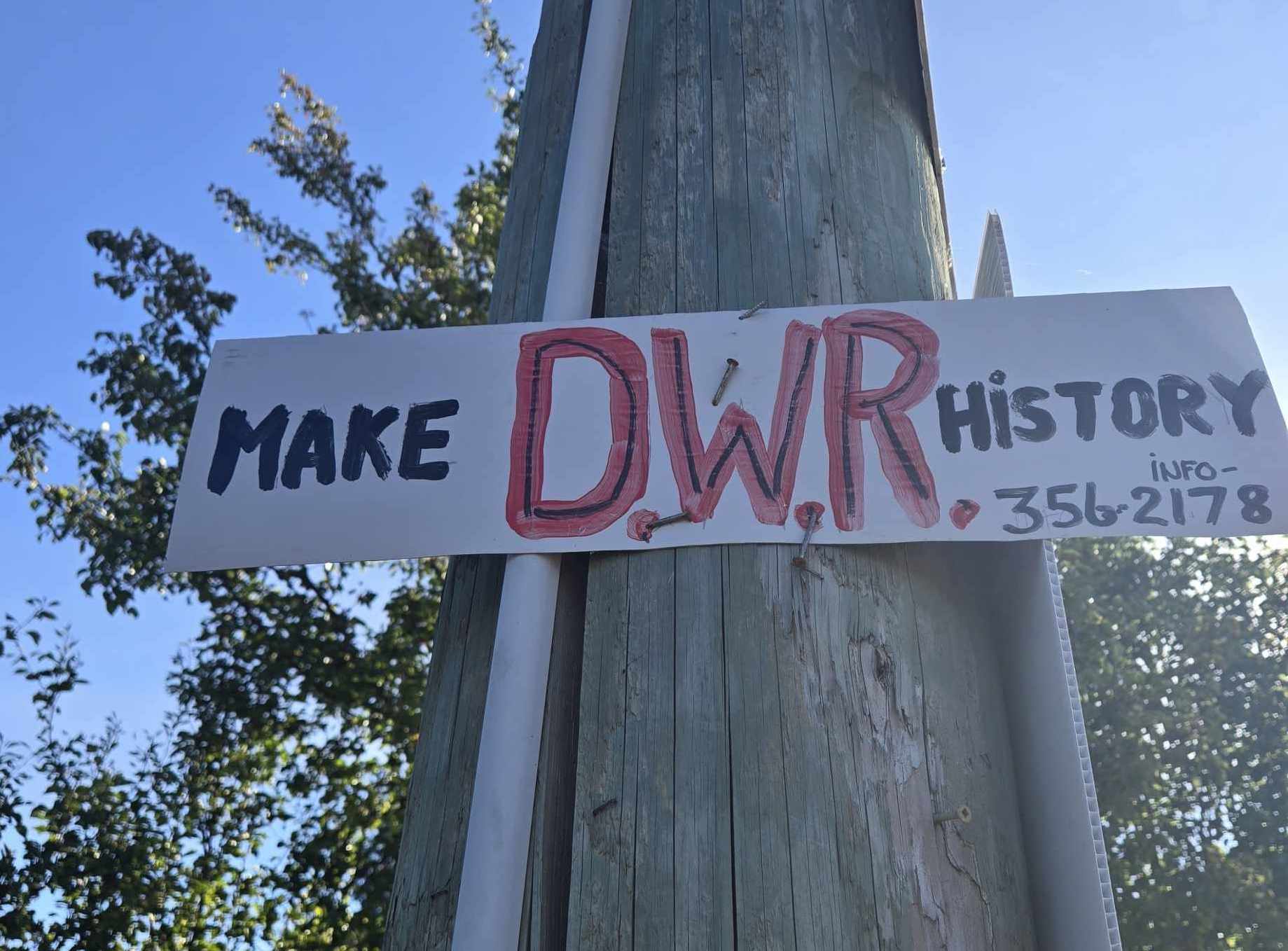 Signs opposing Deep Water Recovery’s shipbreaking operation, such as this one in Cumberland, can be seen throughout the Comox Valley. Photo: Madeline Dunnett / The Discourse