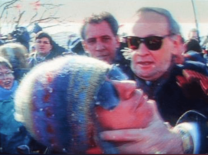 Then-prime minister Jean Chretien grabs protester Bill Clennett by the face at the first Flag Day ceremony in Gatineau, Que., in 1996. Screenshot Courtesy Global-TV.