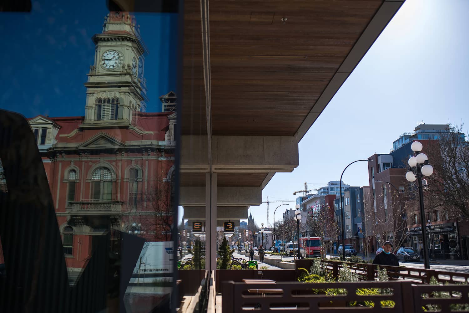 Victoria City Hall is reflected in a downtown building. Photo: James MacDonald / Capital Daily